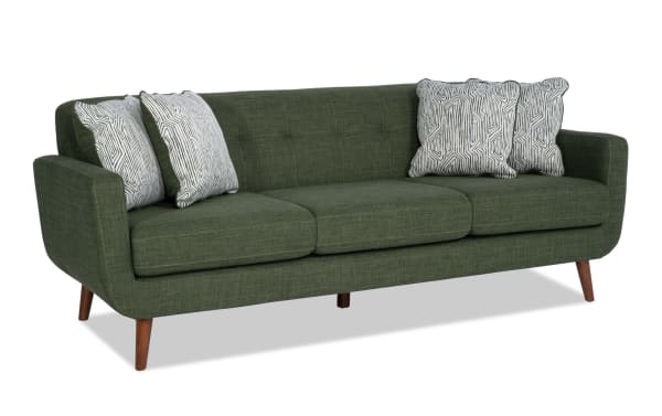 Bettie Avocado 86'' Sofa in green polyester fabric with mid-century modern design, tufted back, track arms, wooden legs, and four patterned accent pillows.