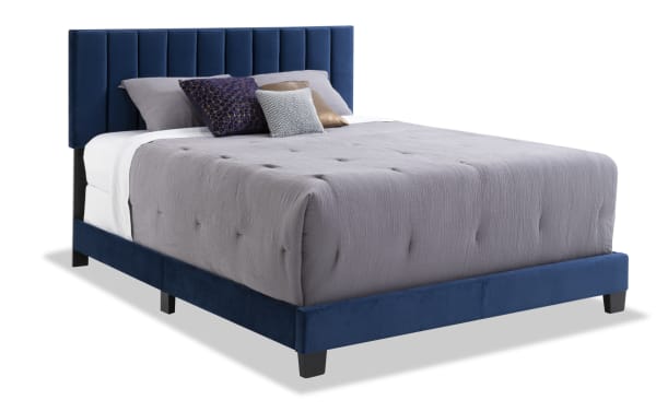Aster Full Blue Upholstered Panel Bed with vertical tufting, thick side rails, and soft blue polyester fabric in transitional style, sturdy slat base.