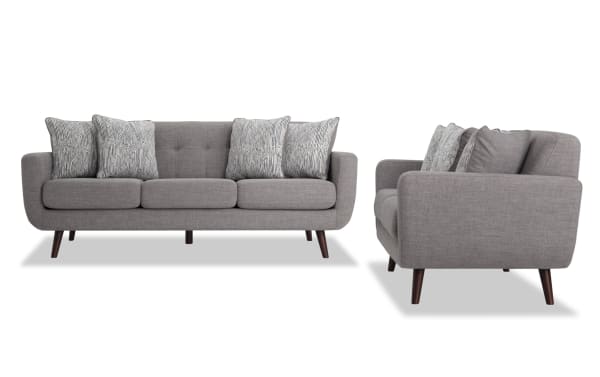 Bettie Gray 86'' Sofa & 65'' Loveseat set in mid-century modern style with gray 100% polyester fabric, tufted backs, track arms, wooden legs, and patterned accent pillows.