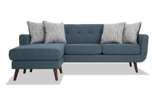 Bettie Teal 86'' Chofa in mid-century modern style with teal 100% polyester fabric, tufted back, four patterned pillows, and wooden legs.