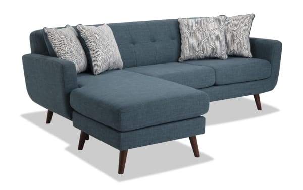 Bettie Teal 86'' Chofa in mid-century modern style with teal 100% polyester fabric, tufted seat back, four patterned pillows, and wooden legs.