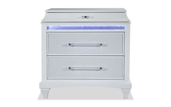 Glamour White 3 Drawer Nightstand from Glamour Bedroom collection, featuring pearly white acacia veneer, mirrored crystal trim, LED lighting, and silver hardware.