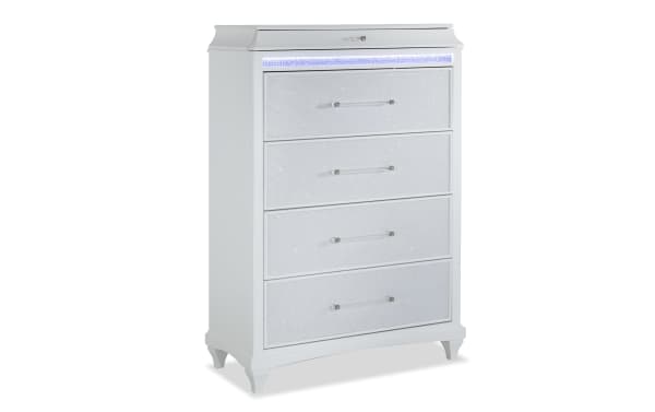 Glamour White 5 Drawer Chest from Glamour Bedroom collection, featuring acacia veneers, MDF, plywood, pearly white finish, mirrored crystal trim, acrylic and silver hardware, LED lighting, and felt and cedar drawer linings for stylish, functional bedroom storage.