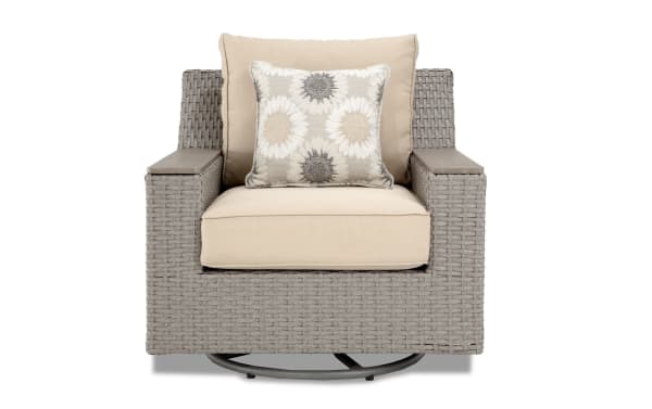 Beige Cottage Chic Outdoor swivel chair with all-weather wicker, powder-coated aluminum frame, and plush polyester cushions with floral accent pillow.