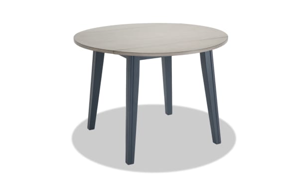 Blake Graphite & Gray Round Drop Leaf Dining Table in cottage style with MDF, birch, mango veneers, and hardwood solids, ideal for small spaces.