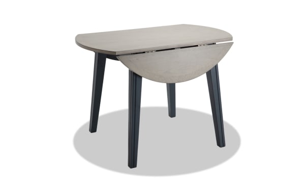 Blake Graphite & Gray Round Drop Leaf Dining Table in cottage style with MDF, birch and mango veneers, rubberwood solids, perfect for small spaces.