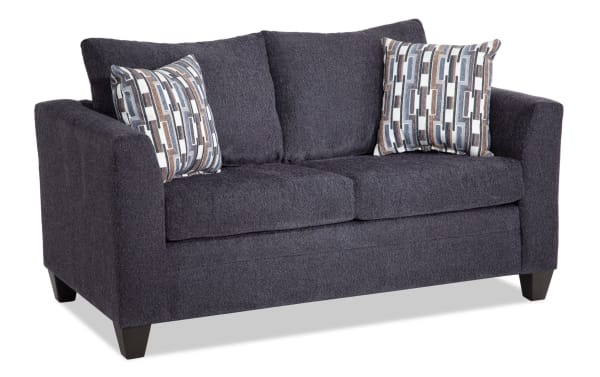 Stevie Charcoal 65'' Loveseat in gray polyester fabric with transitional style, flair arms, oversized seating, memory foam cushions, and patterned accent pillows.