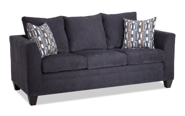 Stevie Charcoal 78'' Sofa in gray polyester fabric with transitional style, flair arms, oversized seating, removable cushions, and patterned accent pillows.