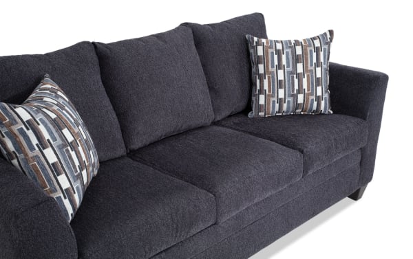 Stevie Charcoal 78'' Sofa in gray polyester fabric with transitional style, flair arms, oversized seating, and patterned accent pillows.
