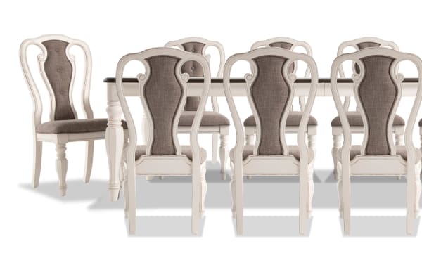 Scarlett 11 Piece White & Beige Upholstered Extendable Dining Set with cottage style, wire brushed oak top, carved legs, and fabric polyester chairs with memory foam seats.