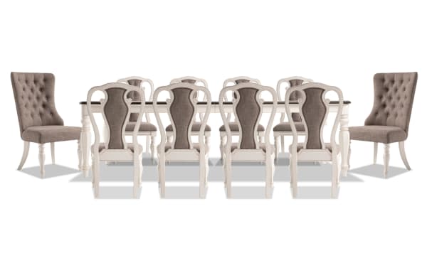 Scarlett 11 Piece Cottage Dining Set with extendable white MDF and oak veneer table, beige polyester upholstered tufted chairs, and carved legs.