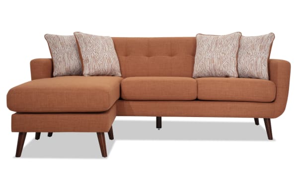 Mid-century modern Bettie Russet 86'' Chofa & 65'' Loveseat set in russet polyester fabric. Features tufted backs, track arms, wooden legs, and patterned accent pillows.