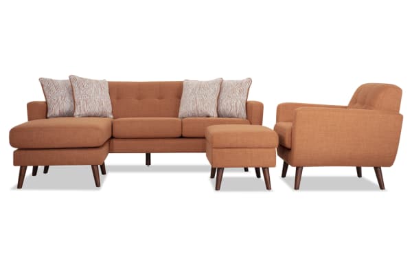 Mid-century modern Bettie Russet 86'' chofa, chair, and storage ottoman set in russet polyester fabric with tufted backs, track arms, wooden legs, and accent pillows.