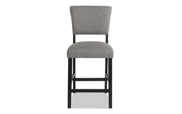 Transitional Elm Dining counter height stool with light gray polyester fabric upholstery, MDF frame, and sturdy black legs for kitchen or bar seating.