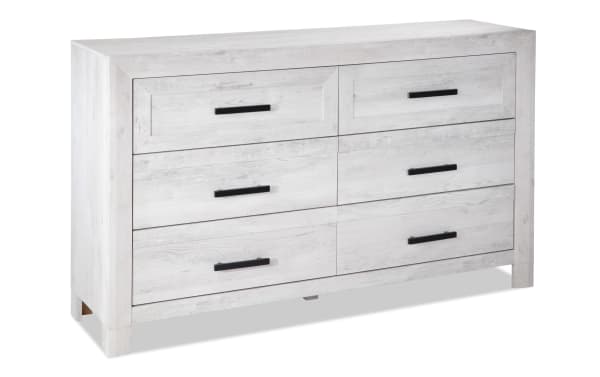 Calvin White 6 Drawer Dresser in engineered wood grain with a contemporary plank-style design, black handles, and spacious storage drawers.