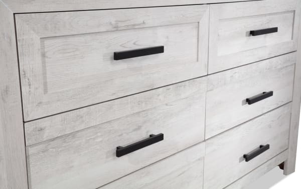Calvin White 6 Drawer Dresser in engineered wood grain with a plank-style contemporary design, black handles, and spacious storage drawers.