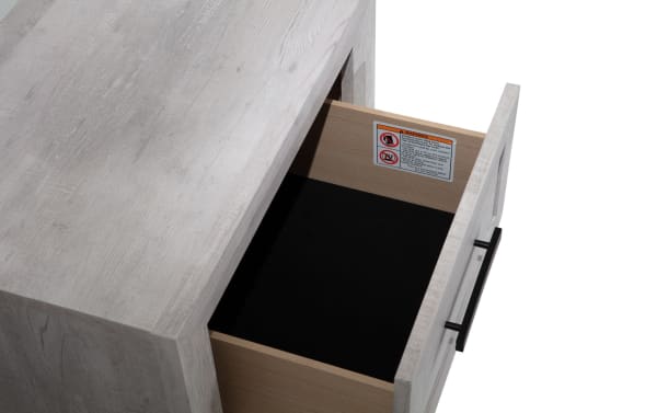 Calvin White Nightstand with Drawer from Calvin Bedroom collection, featuring engineered wood grain, contemporary plank-style design, and a felt-lined storage drawer.