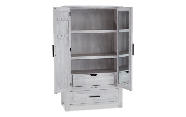 Calvin White 2 Drawer Armoire from Calvin Bedroom collection, transitional style in white MDF and acacia veneers, featuring plank-like texture, chevron door design, adjustable shelves, and mirrored door panel.