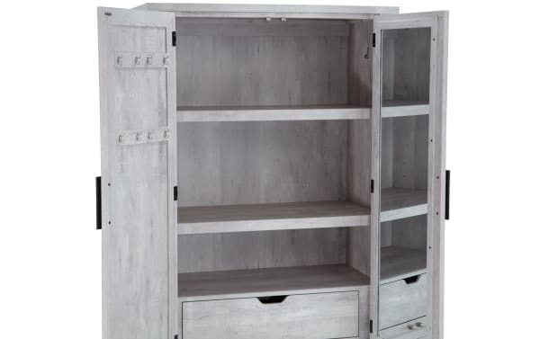 Calvin White 2 Drawer Armoire from Calvin Bedroom collection, transitional style in white MDF and Acacia veneers. Features adjustable rod, moveable shelves, chevron door design, natural wood grain, and two drawers.