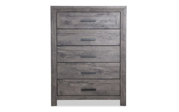 Calvin Gray 5 Drawer Chest in engineered wood grain with a contemporary plank-style design, gray finish, and black metal handles for bedroom storage.