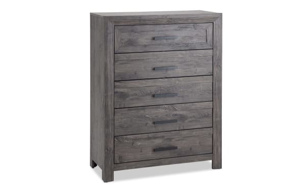 Calvin Gray 5 Drawer Chest in engineered wood grain with a gray plank finish, contemporary style from Calvin Bedroom collection, featuring five spacious drawers with sleek black handles.