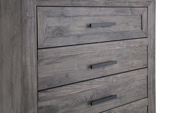 Calvin Gray 5 Drawer Chest in engineered wood grain with a contemporary plank-style design, featuring five spacious drawers and black handles.