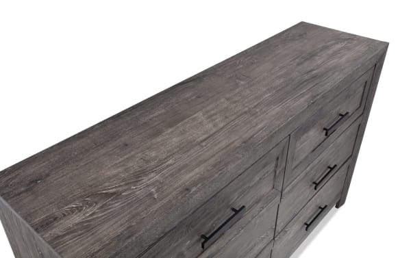 Calvin Gray 6 Drawer Dresser in engineered wood grain with contemporary plank-style design, black handles, and spacious storage drawers.