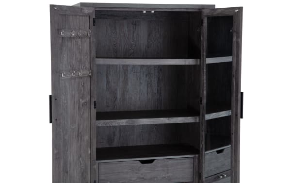 Calvin Gray 2 Drawer Armoire in transitional style with dark gray acacia veneer, MDF construction, adjustable shelves, chevron door design, and glass panel door from Calvin Bedroom collection.