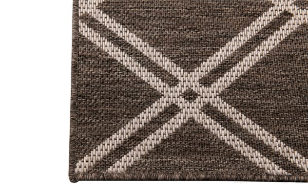 Brown geometric indoor/outdoor rug from the Cottage Chic Outdoor collection, featuring a polypropylene woven texture and transitional style.