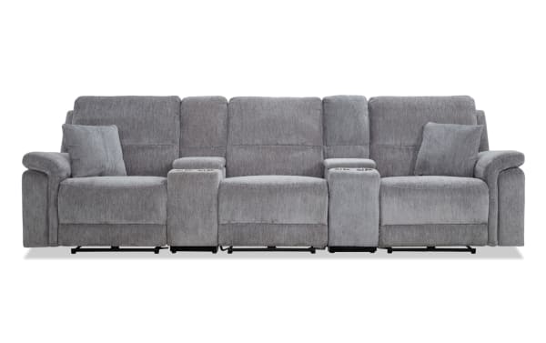 Renegade Gray 130'' power reclining sofa in gray polyester fabric with plush pillows, padded arms, dual consoles with cupholders, USB ports, and hidden storage.