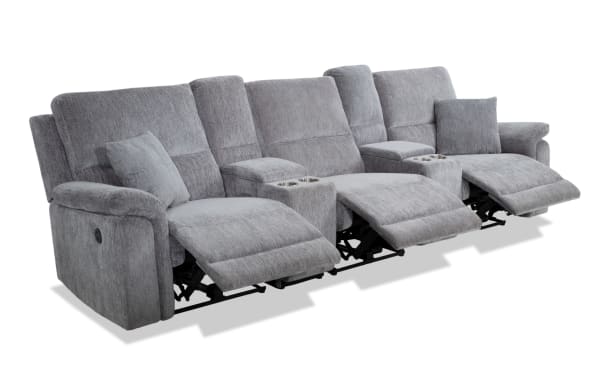 Renegade Gray 130'' power reclining sofa in gray polyester fabric with plush pillows, padded arms, USB ports, dual cupholder consoles, and hidden storage.