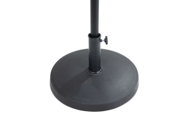 Outdoor black umbrella base with powder-coated aluminum and concrete construction, featuring a transitional style and adjustable pole holder.