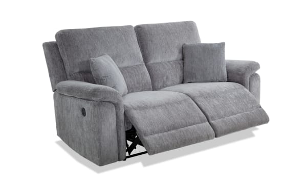 Renegade Gray 75'' power reclining loveseat in gray polyester fabric with plush pillows, padded arms, and built-in USB port for charging devices.