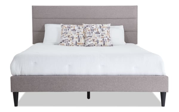 Lowell Full Latte Upholstered Platform Bed in beige polyester fabric with horizontal tufting, MDF frame, slat roll, and center support legs in transitional style.