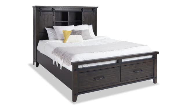 Montana 4 Piece Queen Bed in rustic brown pine solids and veneer, featuring a bookcase headboard with storage, USB ports, power outlets, and footboard drawers.