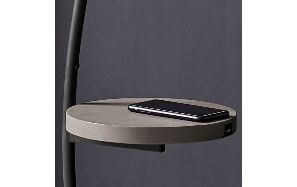 Contemporary Marco 67.5'' black metal LED floor lamp with a vertical glow and a round wireless charging tray table for minimalist spaces.