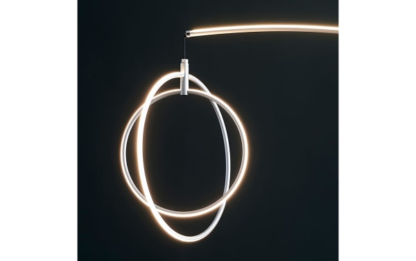 Aspen 81'' Silver LED Arch Floor Lamp in contemporary style, featuring overlapping circular metal LED rings with a cool orbit-style glow.