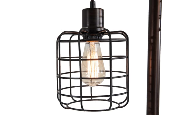 Brooklyn Caged Motif 71'' Black Floor Lamp with industrial-style black metal cage shade and exposed filament bulb, mounted on a gilded post.