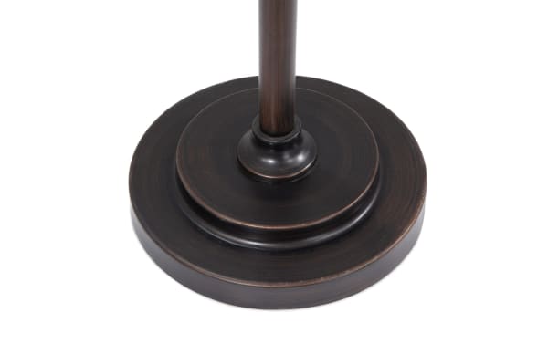 Bronze metal round tiered base of Brooklyn Caged Motif 71'' black industrial floor lamp, supporting gilded post.
