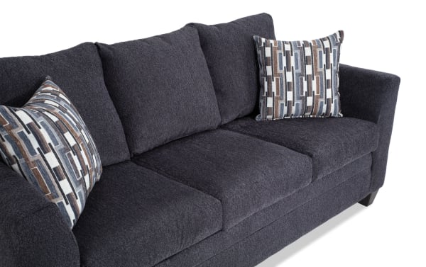 Stevie Charcoal 78'' Sofa & Loveseat in gray polyester fabric with transitional style, flair arms, oversized seating, and patterned accent pillows.