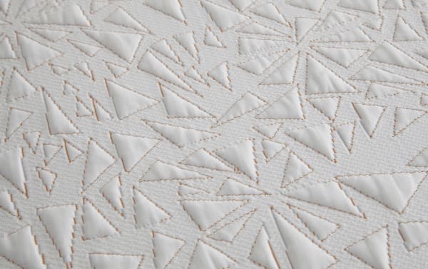 White Copper Sport Hybrid 11.5'' Twin XL mattress cover with textured geometric triangle quilting and copper-colored stitching, part of the Copper Sport collection.
