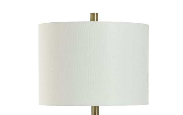 Transitional Rayna Brass Table Lamp with white linen fabric shade, sleek brass metal base, and built-in USB/USB-C charging ports for bedside use.