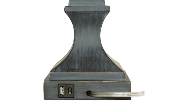 Base of Bolton Gray Table Lamp in transitional style, featuring dark resin with USB and USB-C charging ports for device power.