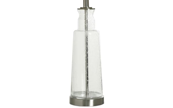 Clear seeded glass table lamp with a rustic white linen shade, chrome base, and built-in USB/USB-C charging ports for bedside use.