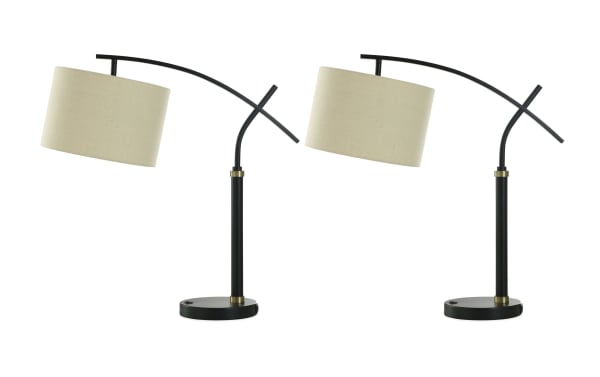 Set of 2 Hunter Blackened Bronze & Gold contemporary table lamps with beige linen drum shades, metal swing-arm design, and USB/USB-C ports for charging.