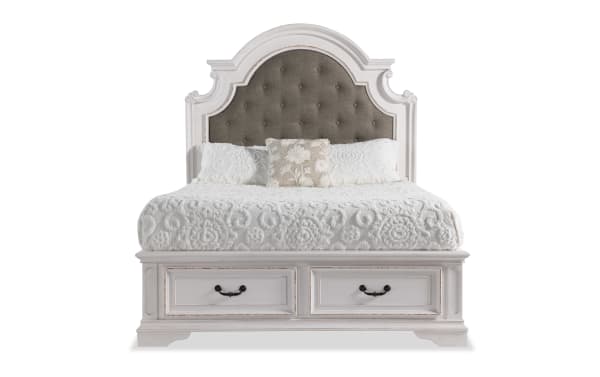 Scarlett farmhouse king bed with gray upholstered polyester fabric headboard, white oak storage platform, and antique brass drawer handles.