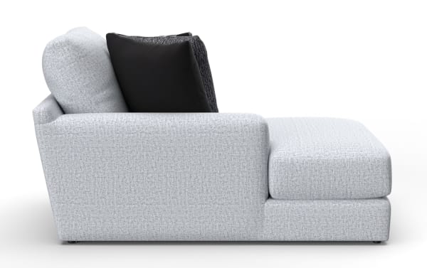 Modern light gray fabric chaise lounge sofa with textured upholstery, featuring black and dark gray accent pillows, ideal for contemporary living rooms.