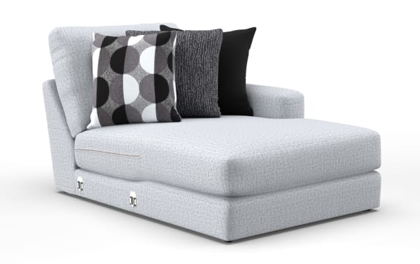 Light gray fabric chaise lounge with a single armrest, featuring three decorative pillows in black, gray, and patterned designs, ideal for modern living spaces.
