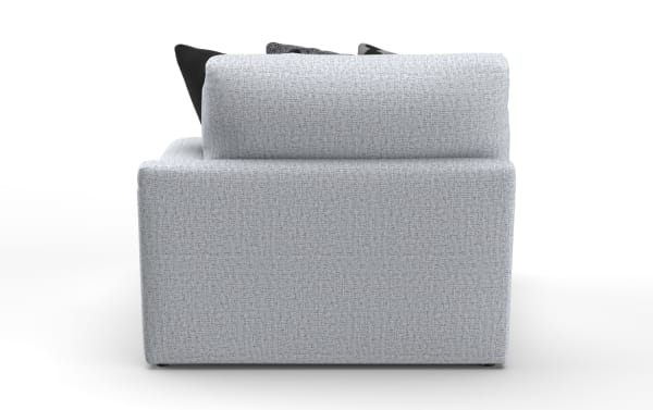 Light gray fabric armchair with a textured weave, featuring a cushioned backrest and visible black and patterned throw pillows.