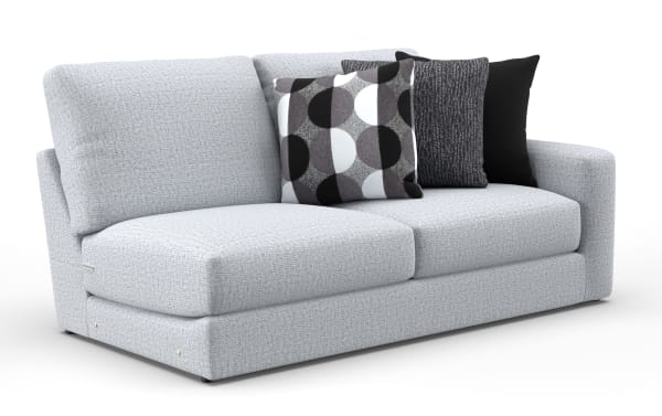 Light gray fabric sofa with plush cushions and three decorative pillows in black, gray, and white geometric and solid patterns, modern style.